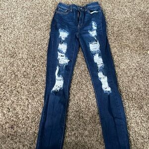 Ripped high- waisted blue jeans. GENTLY WORN!